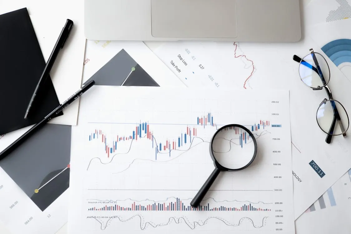 Person viewing financial trading data on a smartphone
