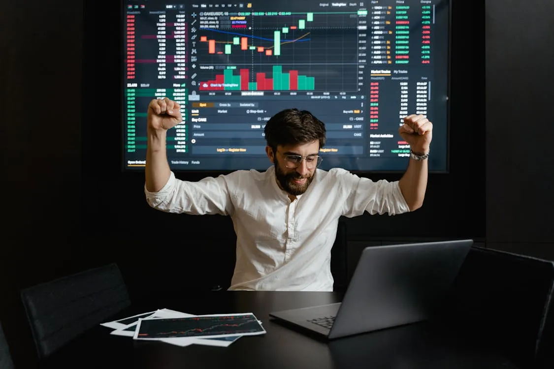 Trader analyzing crypto charts and data representing DeFi market activity